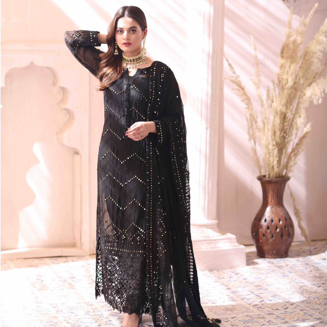A girl standing in 3 Piece black Embroidered Chiffon Suit.