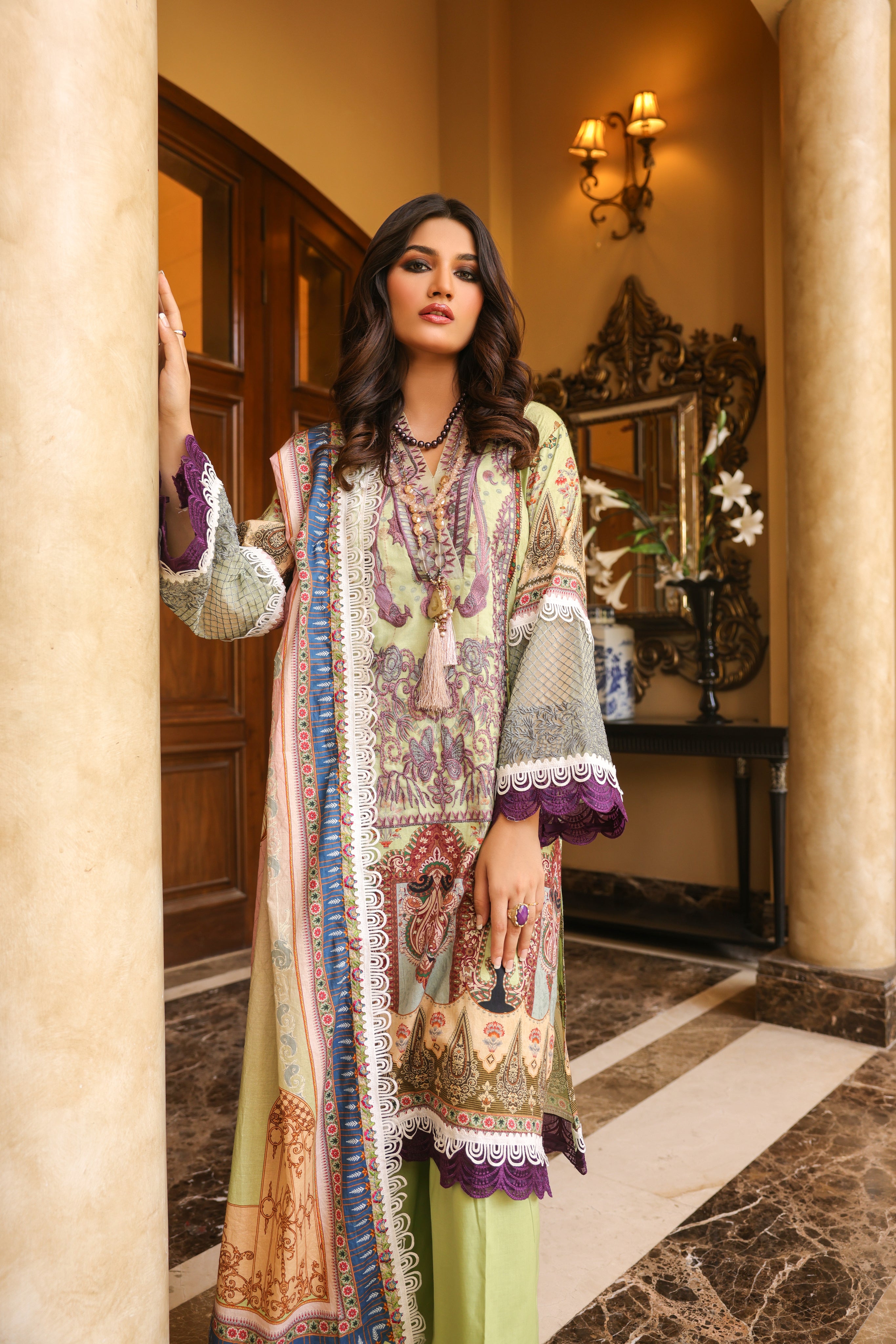 A female model standing in Digital Lawn Suit with Embroidered Selves and dupatta on shoulder.
